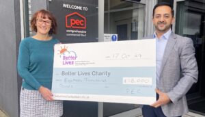 Photo of colleagues with cheque