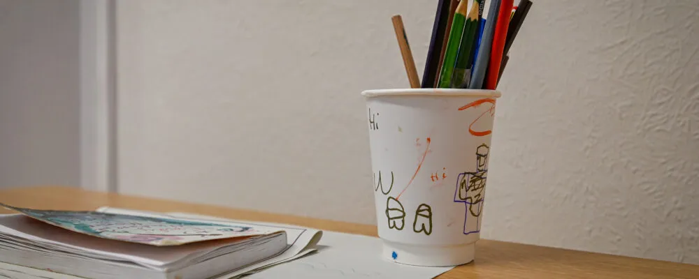 Colouring pens in a cup
