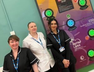 Photo of care trust staff with new cardio wall