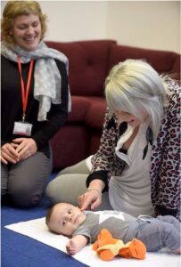 Image of staff and baby