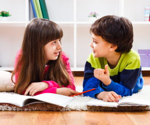 Two children talking about books