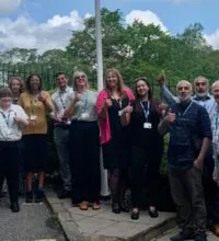 Chief executive Therese Patten gives a big thumbs up to members of the Estates and Facilities team