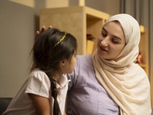 Photograph of mother talking with child