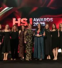 Naomi Holdsworth, Operations Service Manager at Bradford District and Craven Talking Therapies at awards ceremony with colleagues from the service and comedian Rob Brydon.