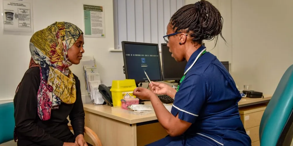 Photo of nurse and patient