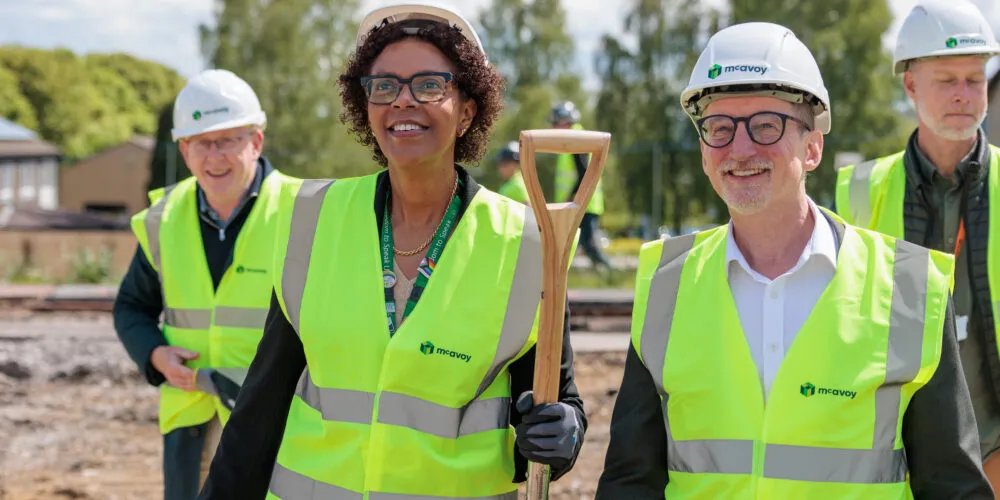 Image of Therese Patten and Mike Woodhead holding a spade on the LMH building site