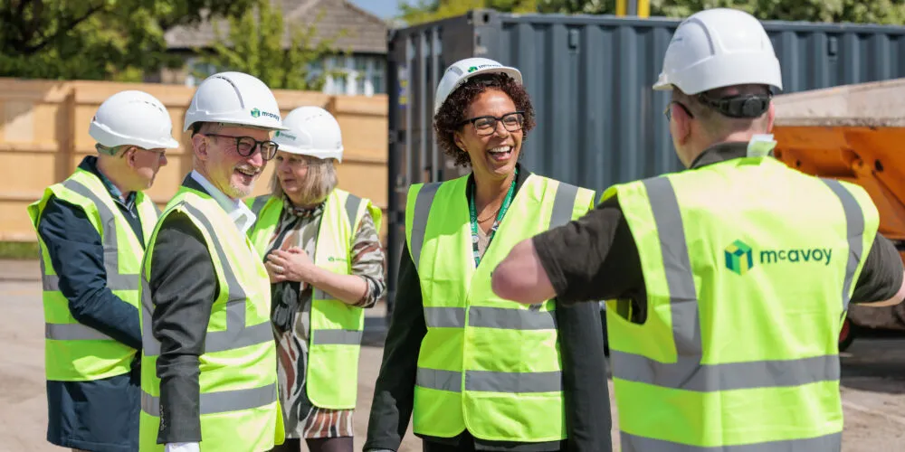 Image of the Trust and McAvoy teams on the building site