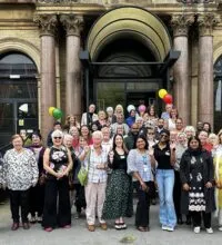 A group of people stood at the top of stairs