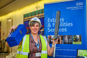 Image of a woman with a hard hat and tool box